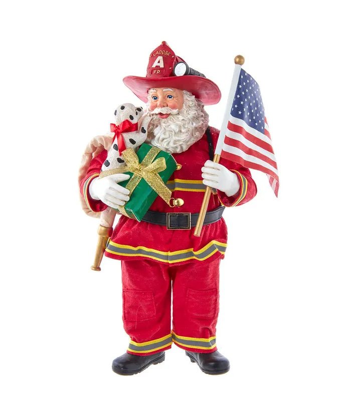 10.5" Fabriché™ Fireman With American Flag Santa - Holiday Warehouse